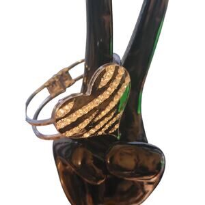 Silver toned Heart Bracelet with Spring closure.